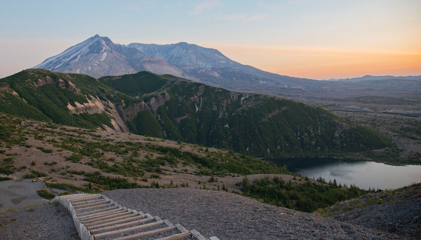 Mount St. Helens is a purple, majestic sight over the skyline in July 2023 at Windy Ridge, a short hike and viewpoint at the end of Forest Service Road 99, accessible out of Randle.
