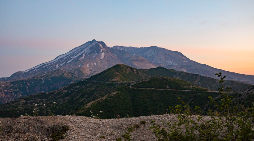 Mount St. Helens appears in shades of blues and purples just after sunset, seen from the road to Windy Ridge Viewpoint on Thursday.