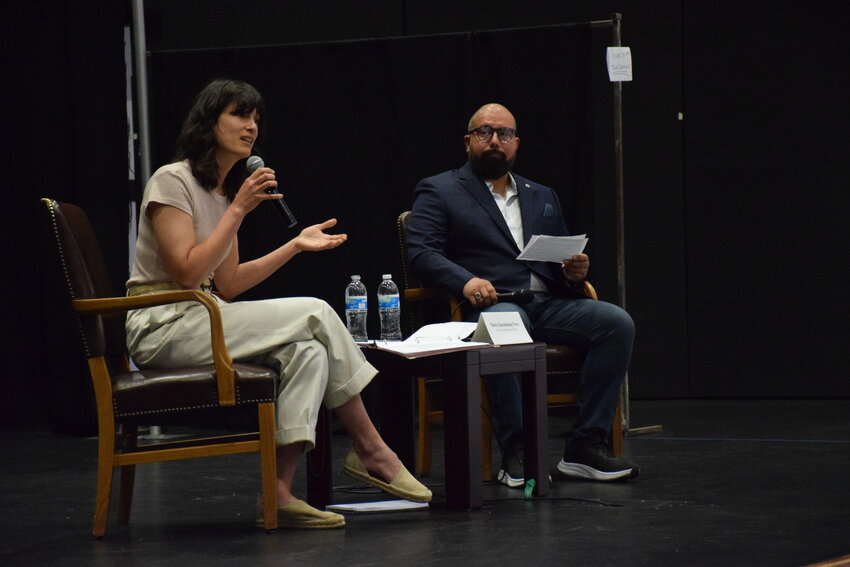 U.S. Rep. Marie Gluesenkamp Perez, D-Skamania County, answers questions next to Battle Ground City Councilor Adrian Cortes, the emcee for a town hall meeting with the Congresswoman at Battle Ground High School July 6.