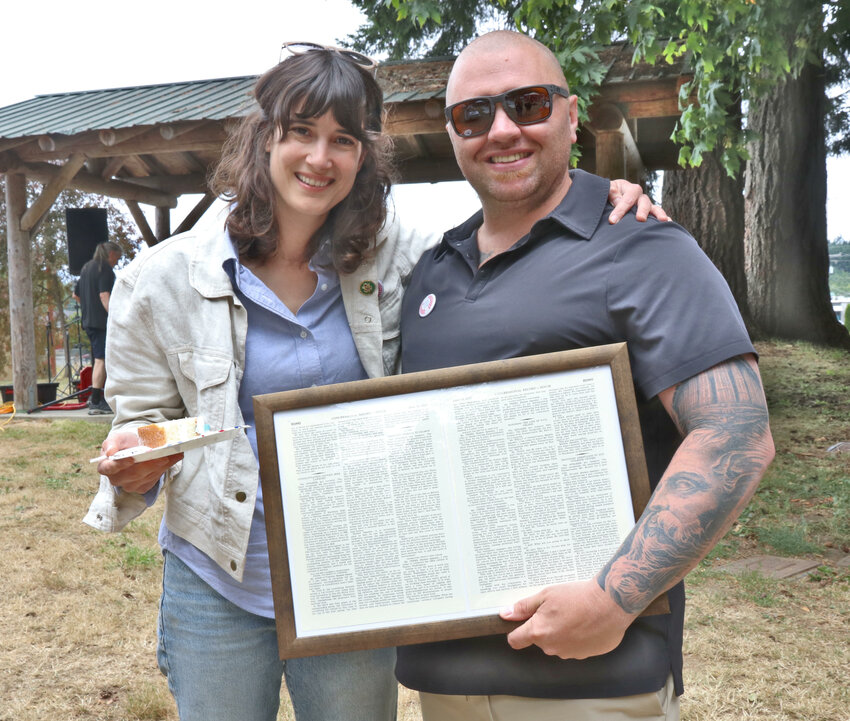 Congresswoman Maire Gluesenkamp Perez stands with Tenino Mayor Wayne Fournier after presenting the City of Tenino with a congressional record and cutting the city&rsquo;s birthday cake during Tenino&rsquo;s 150th Jubilee at Tenino City Park on Saturday, July 8.