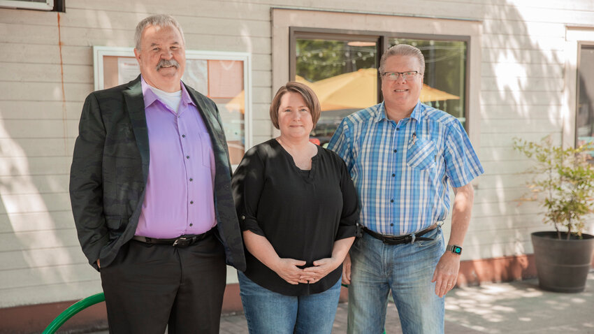 From left, President of the Conservative Coalition of Lewis County Dave Germain, Vice President Sherri Murphy and board member Frank Corbin pose for a photo in downtown Centralia on Tuesday, July 11.