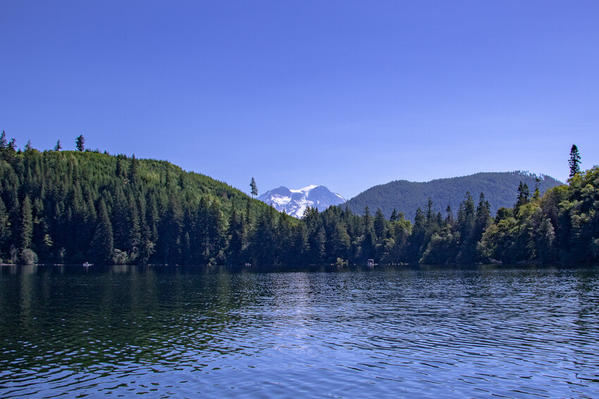 Mount Rainier peeks through the Cascade foothills surrounding Mineral Lake on Saturday, July 15.