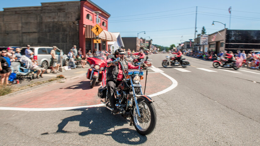 The Tenino Motorcycle Drill Team rides along Sussex Avenue West during the Oregon Trail Days parade on Saturday, July 22, 2023.
