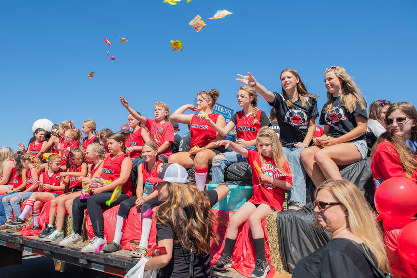 Tenino athletes throw candy from a float during the Oregon Trail Days parade on Saturday, July 22.