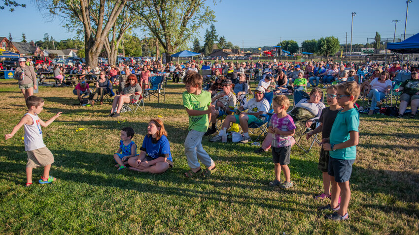 Visitors dance at Recreation Park as The Olson Bros Band performs in Chehalis for the &ldquo;Music in the Park&rdquo; series Friday evening.