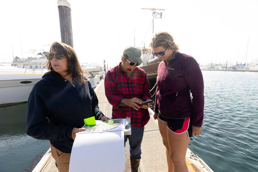 From left, Amy Leitman, founder of Marine Survey and Assessments, an employee-owned cooperative, discusses the diving situation with Bryan DeCaterina, center, field lead and dive safety officer, and Darby Flanagan, scientific diver, at the Skyline Marina in Anacortes. MSA has been run as a worker cooperative since 2020, when Leitman stepped down from being &ldquo;the boss.&rdquo; (Karen Ducey/The Seattle Times/TNS)