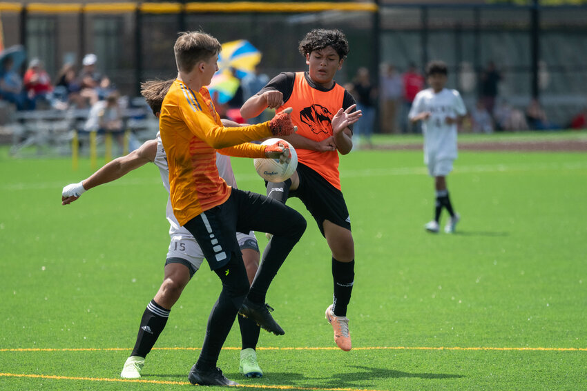 Damion Corona flies into a collision with the R.A. Long goalkeeper during Centralia's matchup with the Lumberjacks in the finals of the inaugural Blazer Cup, July 30 at Bob Peters Field.