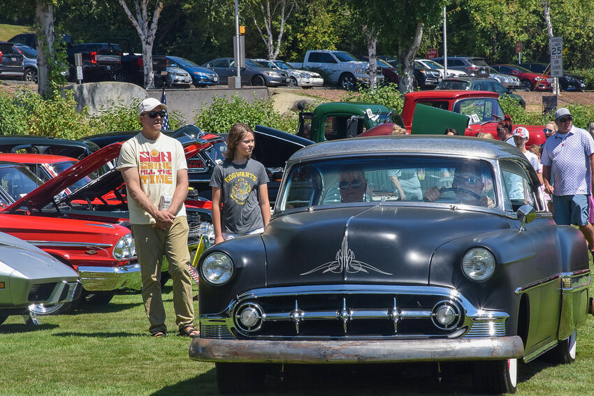 A classic car rides up to the awards table during the La Center Our Days car show July 29.