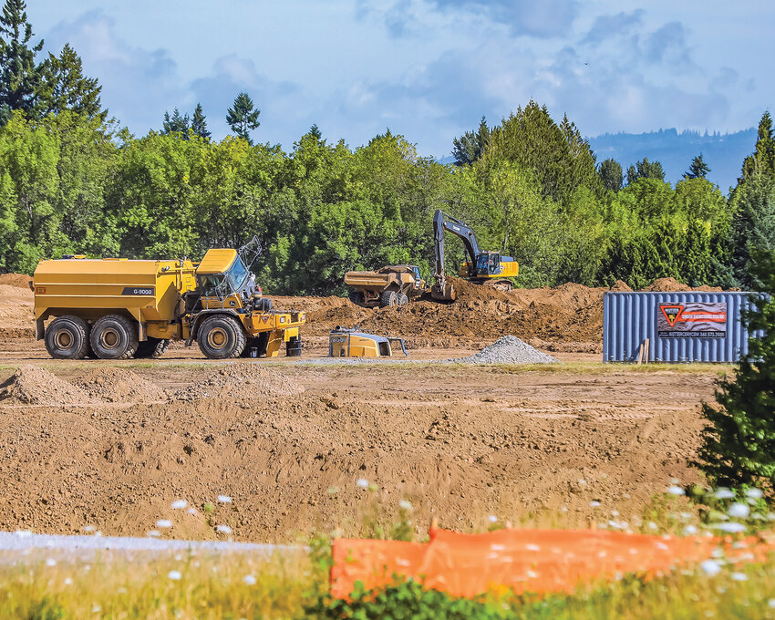 Construction crews prep the construction site Ridgefield&rsquo;s         future Costco and more businesses on Tuesday, July 25.
