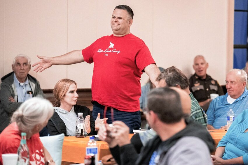 Morton Police Chief Roger Morningstar smiles and stands while sporting a shirt that reads &ldquo;Keep Lewis County Red&rdquo; during a Lewis County Republicans meeting on the topic of filling the District 3 Commissioner position on Oct. 4, 2021.