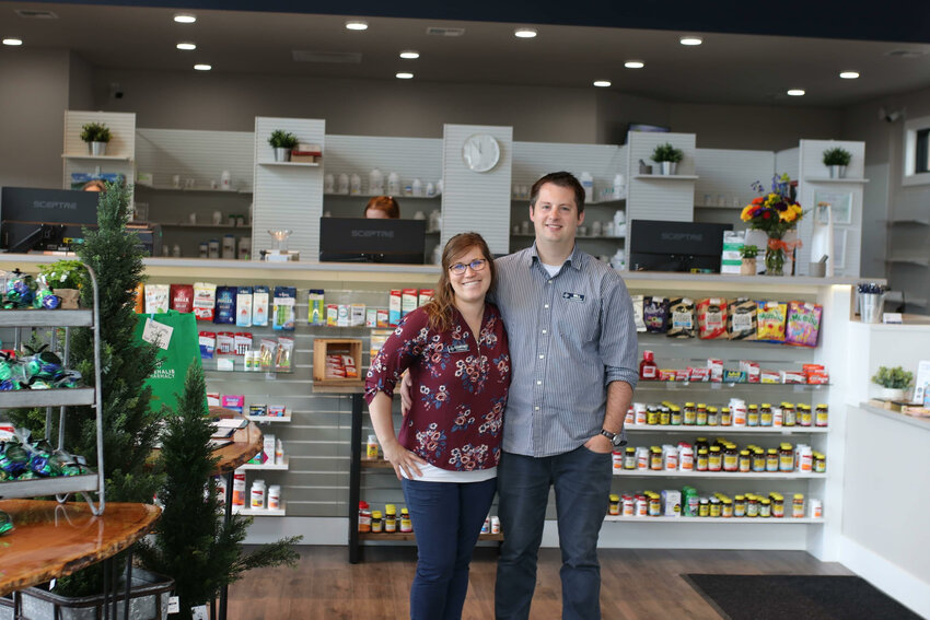 Pharmacists and owners Courtney and Will Quinby pose for a photo inside the newly-opened Chehalis Pharmacy.
