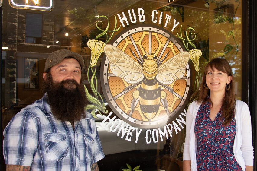 New business owners and partners Beau Gromley and Jennah Kemp stand in front of Hub City Honey on Thursday, Aug. 3.