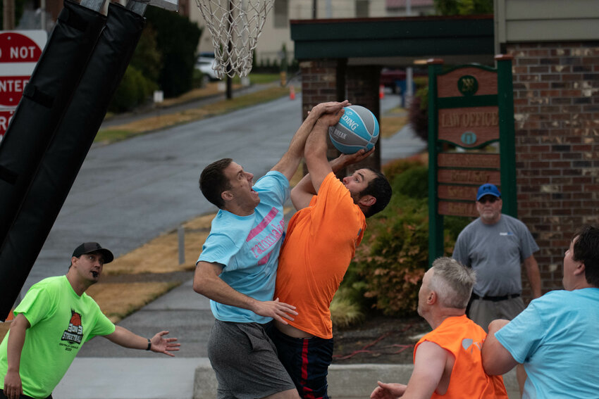 The Rainmakers' Cody Pedersen contests Toledo Tel's Joe Nelson during an adult division game at the Centralia-Chehalis Chamber of Commerce 3-on-3 Streetball Tournament, Aug. 5 in Chehalis.