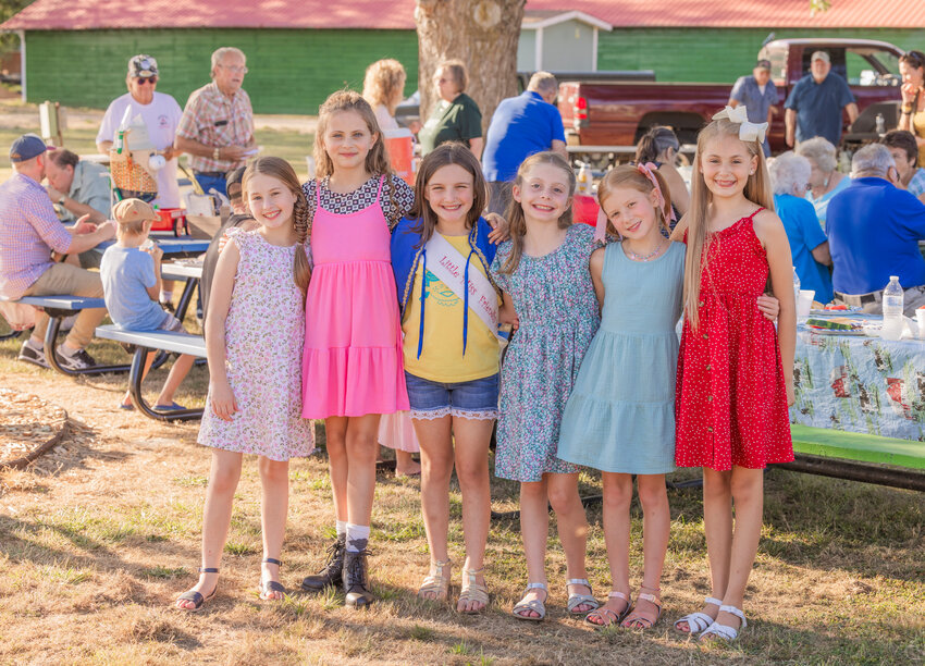 Little Miss Friendly finalists Clara Hansen, Aria Hoffman, Emma Elder, Kimber Serl and Riot Anderson smile for a photo with current Little Miss Friendly Emma Britton, center left, during a picnic event sponsored by The Fair Association at the Southwest Washington Fairgrounds on Tuesday, Aug. 8, in Centralia. The fair office last week released the list of the top five girls in the running for Little Miss Friendly, the &ldquo;Living Logo&rdquo; of the Southwest Washington Fair. An 8- to 10-year-old adorned in a Prussian blue cape, Little Miss Friendly embodies the fun and friendly atmosphere of fair week. The ultimate titleholder, who will earn the cape from Britton, of Chehalis, will be announced on the first day of the fair at 6 p.m. Tuesday, Aug. 15, on the Saloon Stage. Attendance to the ceremony is free with admission to the fair. Learn more about the Southwest Washington Fair at https://southwestwashingtonfair.org/.  A special section focused on the Southwest Washington Fair is included with the Thursday edition of The Chronicle.
