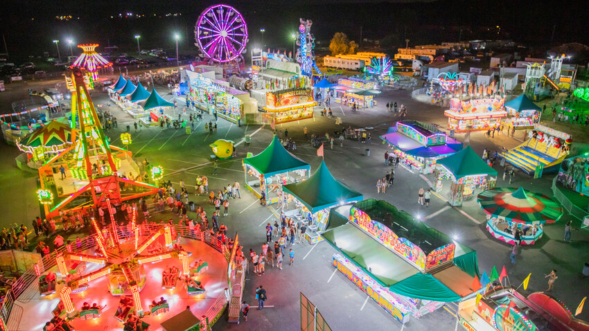 Lights illuminate rides and carnival games at the Southwest Washington Fairgrounds in 2022.