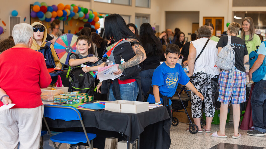 Students receive school supplies during a &ldquo;Back To School&rdquo; resource fair hosted by the Lewis County Youth Mentorship Program in the TransAlta Commons on Thursday, Aug. 10, 2023, at Centralia College.