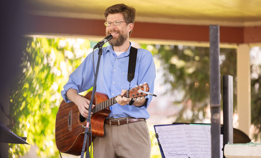 Chronicle columnist Brian Mittge smiles and sings a song about George Washington on Founders Day at George Washington Park on Saturday, Aug. 12, 2023, in Centralia.