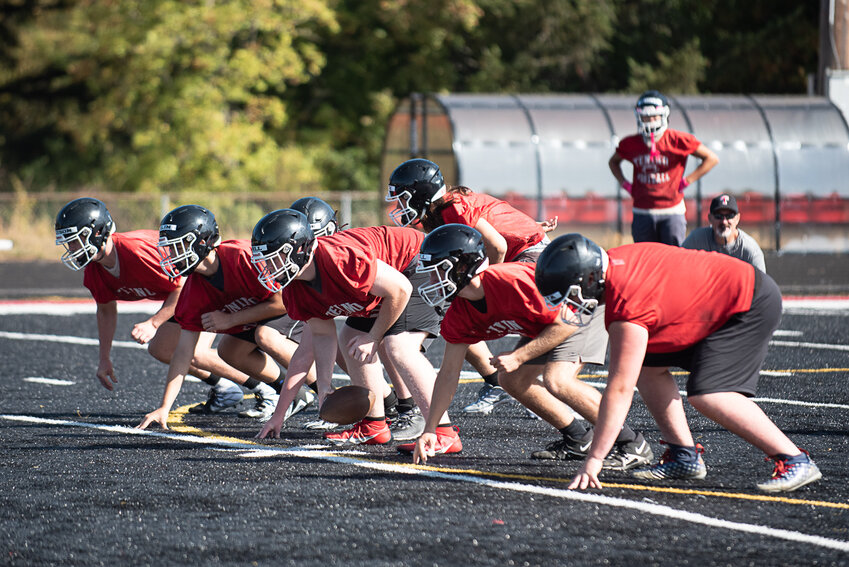 The Tenino offensive line is ready for the snap during an offensive drill at Tenino's practice on Aug. 18.