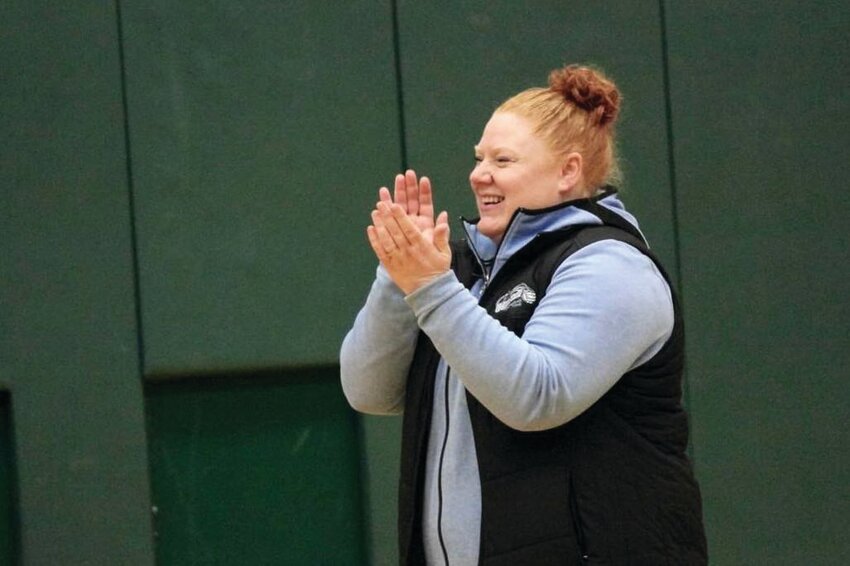 Heidi Deford, Yelm High School&rsquo;s new volleyball coach, claps while she coaches her select team.