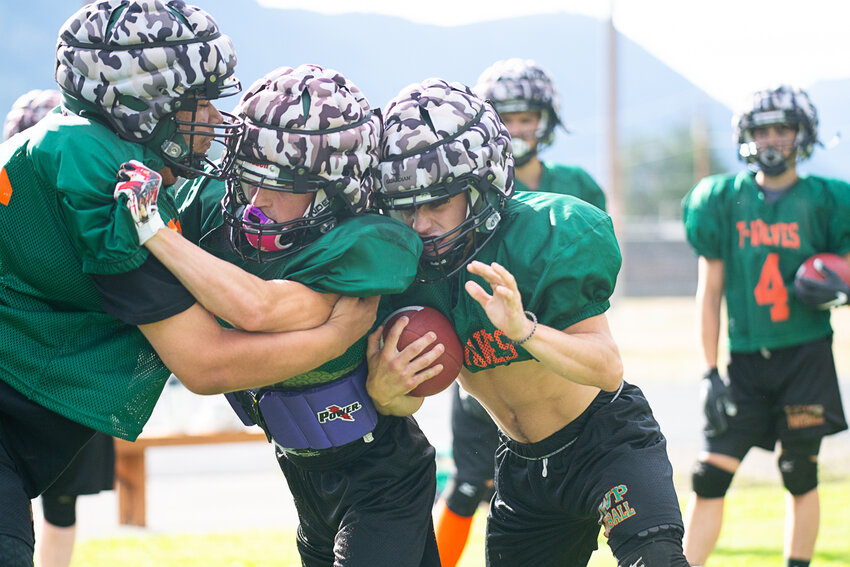 Judah Kelly blocks for Brecken Pelletier during Morton-White Pass' practice on Tuesday, Aug. 22, in Morton.