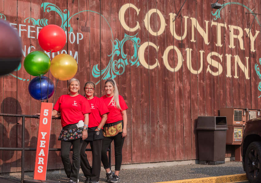 From left, Sierra, Stephanie and Keeley Campbell smile for a photo outside Country Cousin in Centralia on Wednesday, Aug. 23.