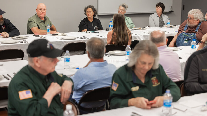 Lewis County Commissioner Scott Brummer tells fire commissioners from across the county why he and his seat mates voted to place a 911 tax initiative on the November ballot during a meeting at Lewis County Fire District 6&rsquo;s station on Jackson Highway in Chehalis on Monday.