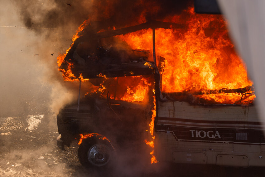 Smoke and flames fill an RV underneath the E. 6th Street overpass in Centralia on Friday, Aug. 25.