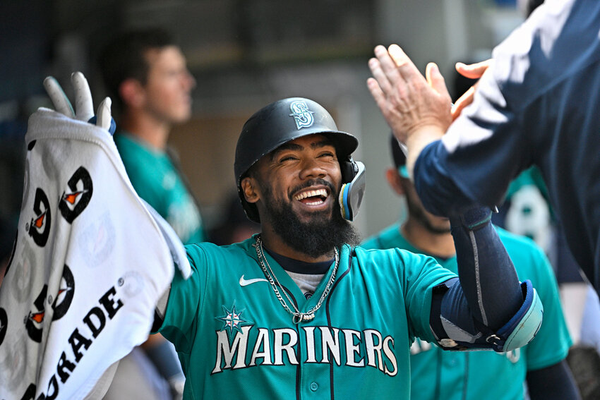 Teoscar Hernandez #35 of the Seattle Mariners celebrates with teammates after hitting a solo home run during the eighth inning against the Kansas City Royals at T-Mobile Park on August 26, 2023 in Seattle, Washington. (Photo by Alika Jenner/Getty Images TNS)