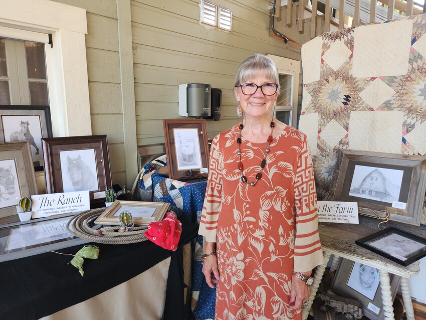 Pat Anderson is pictured with some of her art during a recent event at Owl and Olive near Doty.
