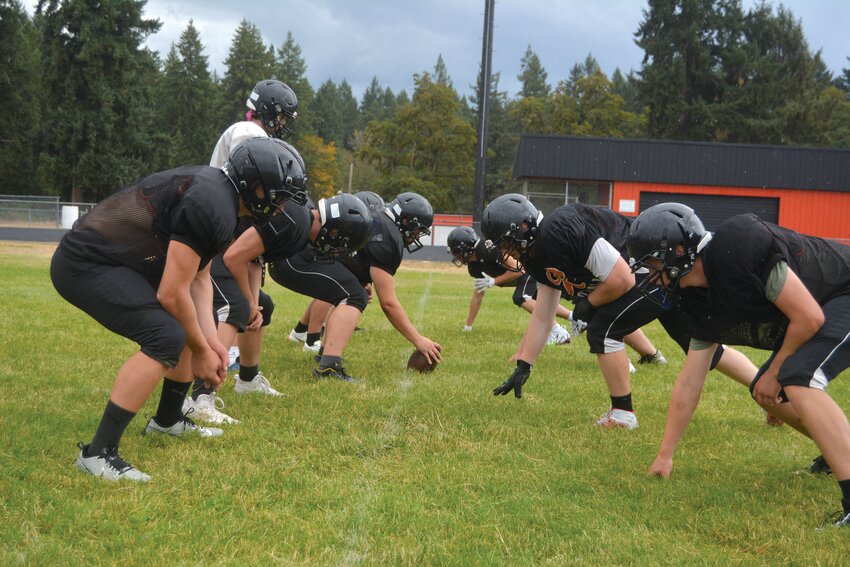 The Rainier Mountaineers prepare for an inside zone drill during practice on Aug. 22.