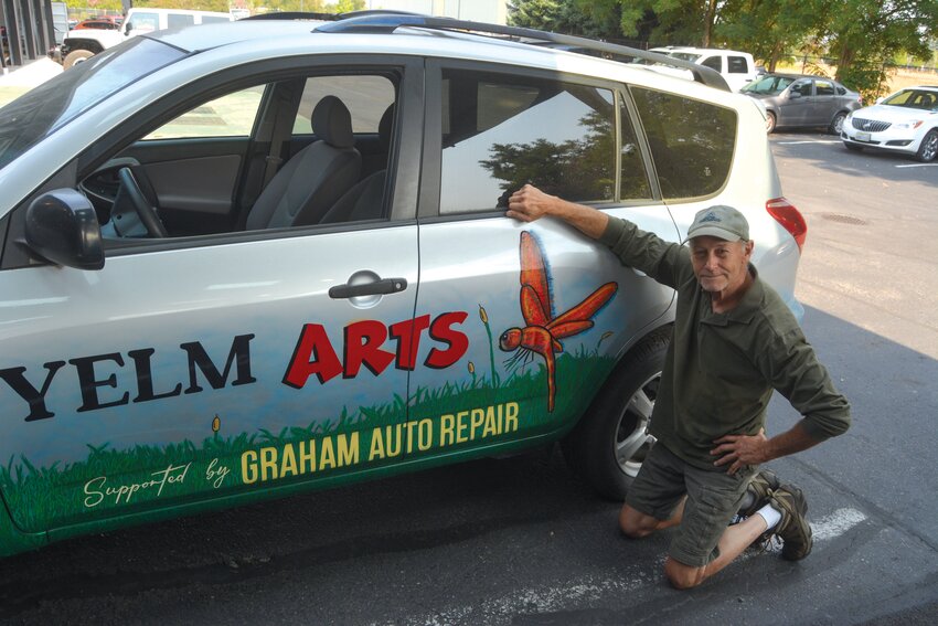 Michael Heaton poses with his finished work in the Graham Auto Repair parking lot on Aug. 24.