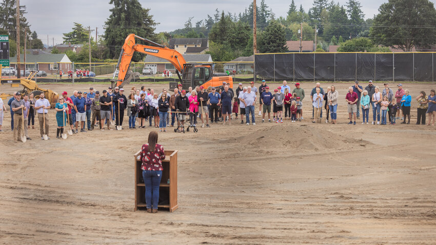 Attendees gather for a groundbreaking ceremony at W.F. West High School organized by the Chehalis School District and Chehalis Foundation on Monday, Aug. 28, as athletes prepare to play on new turf in Chehalis.