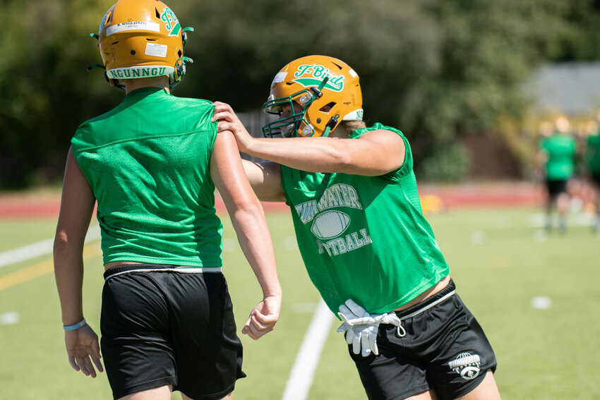 Dane Iversen goes through a defensive drill during Tumwater's practice on Friday, Aug. 18.