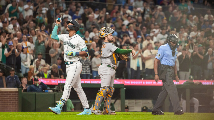 Julio Rodr&iacute;guez celebrates a home run at T-Mobile Park in Seattle on Monday, Aug. 28, 2023.