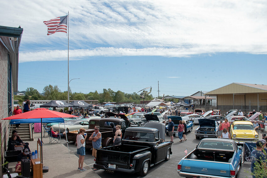Attendees and vehicles are pictured at the Rust or Shine Car Show and Music Festival at the Veterans Memorial Museum in Chehalis in 2022.