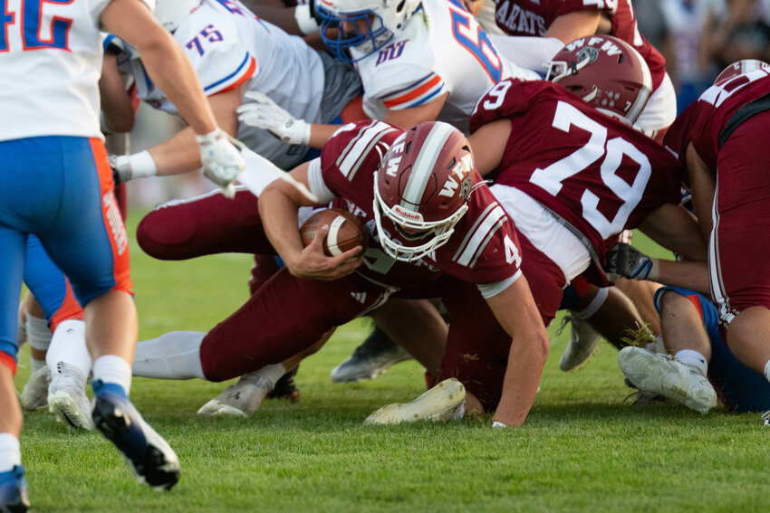 Gage Brumfield dives across the goal line for a 1-yard touchdown in the first quarter of W.F. West's 27-21 loss to Ridgefield on Sept. 1.