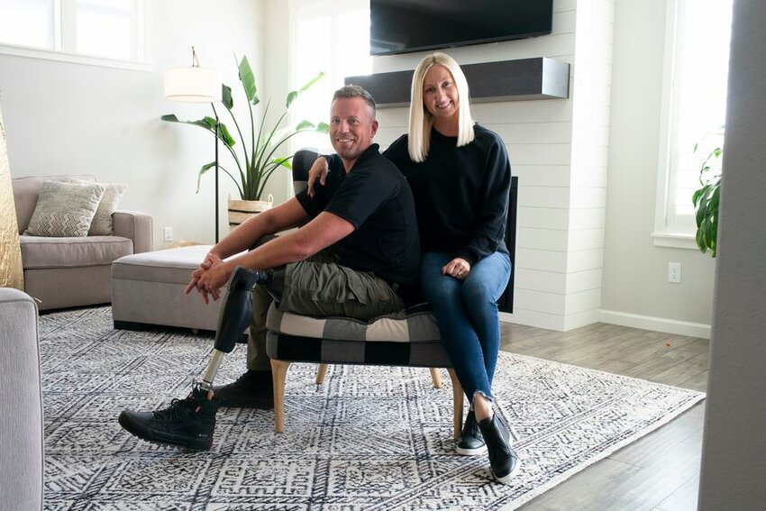 Drew Kennison, shown here at home with his wife, Leah, is a deputy with the Clark County Sheriff's Office. The course of his life changed when a massive snowstorm led to a tree falling on his vehicle, injuring him. (Photo: Beth Nakamura, The Oregonian/OregonLive)