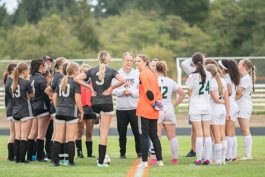Napavine coach Mike Dieckman gathers both his team and Evergreen Lutheran to inform them that the match would have to be abandoned prior to the beginning of the second half.