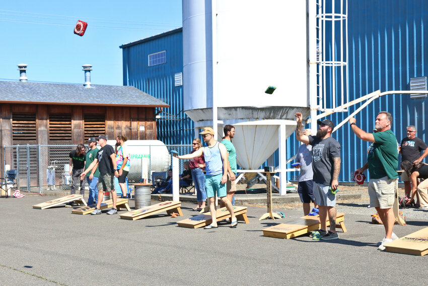 Beanbags fly during Dick&rsquo;s Brewing Company&rsquo;s Cornhole and Sausage Fest in Centralia on Saturday, Sept. 9. A total of 64 teams competed in a bracket-style tournament benefiting the Centralia-Chehalis Chamber of Commerce&rsquo;s Rob Fuller Scholarship Fund.