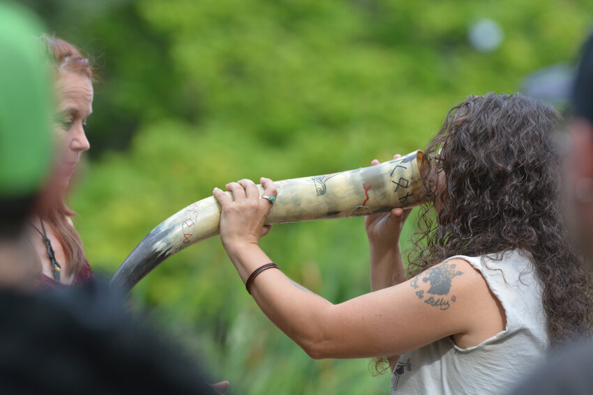 An attendant of Vegtam&rsquo;s ceremony at the Norse West Viking Festival on Sept. 10 drinks blessed mead from a drinking horn.