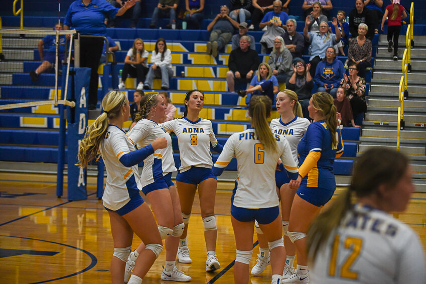 The Pirates celebrate after scoring a point during their win on Sept. 12.