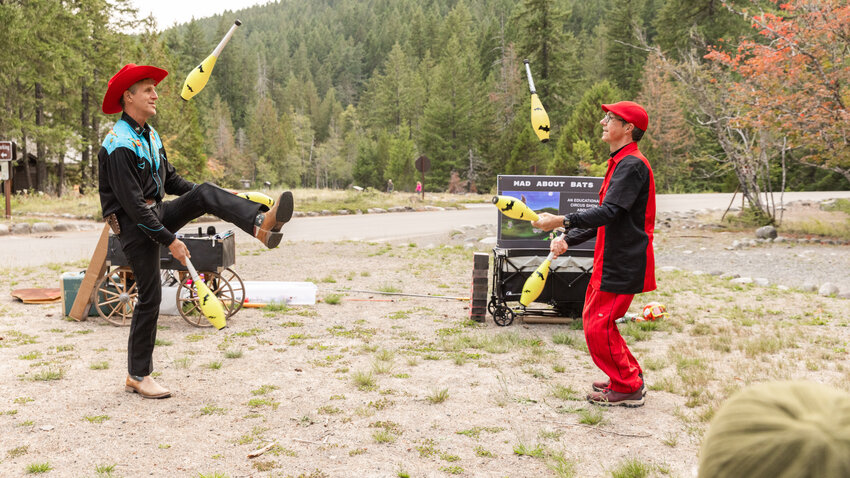 David Lichtenstein and JuggleMania&rsquo;s Rhys Thomas throw bats into the air while juggling during a Vaudeville-esque show at Mount Rainier National Park on Tuesday, Sept. 12.