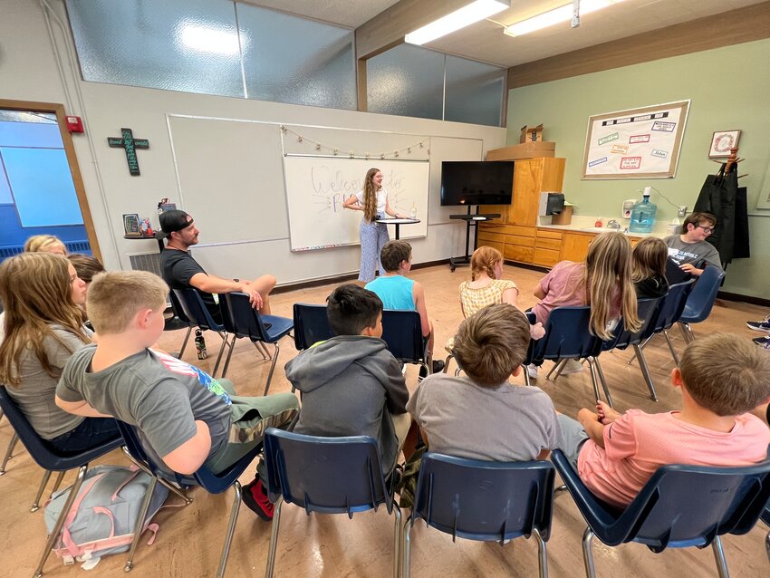 Kayleigh Smith leads the junior high class in a get-to-know-you discussion during the Bethel After School Program, which launched Sept. 13. It provides games, art, conversation and other activities from 12:30-4 p.m. every Wednesday as part of Olympic School.