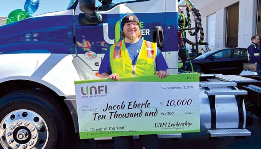 Jacob Eberle was one of four United Natural Foods associates selected as a 2023 Elite Driver of the Year as part of the company&rsquo;s Driver Ambassador Program. This photo of Eberle and a check for $10,000 was provided by the company.