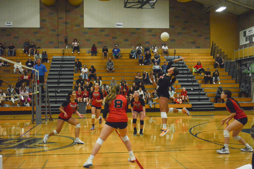 Yelm High School libero Layah Hicks (center) hits the ball during the Tornados&rsquo; 3-1 victory over the Todd Beamer Titans Monday, Sept. 18. The victory gave Yelm its first of the season.