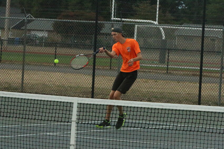 Jacoby Corwin swings during his No. 1 singles match against R.A. Long on Sept. 19.