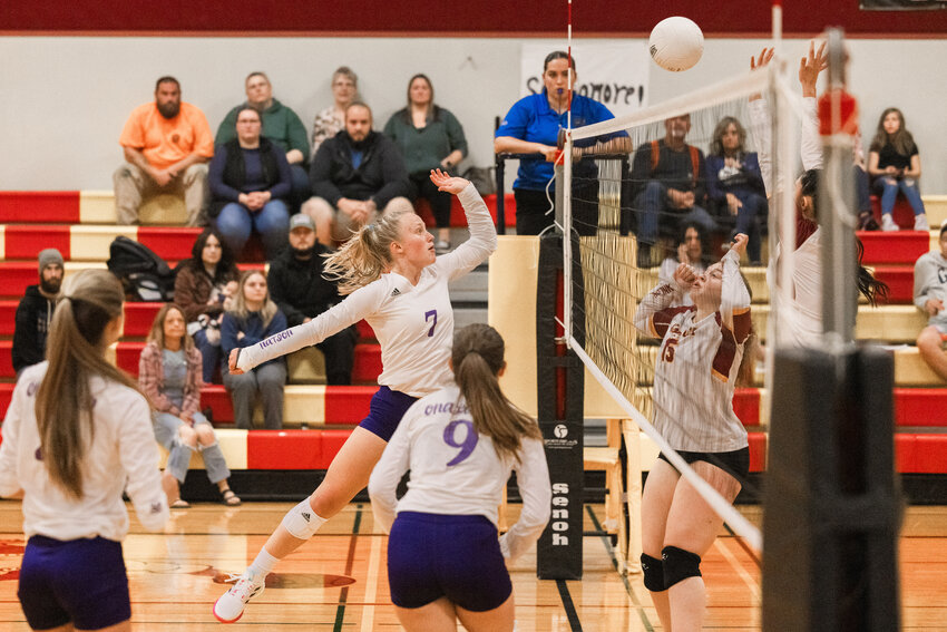Onalaska&rsquo;s Emalie Jacoby (7) hits the ball over the net during a match against Winlock on Thursday, Sept. 21.
