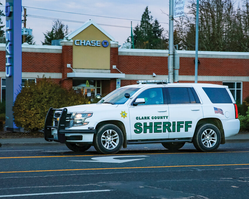 A Clark County Sheriff&rsquo;s Office vehicle drives down Main Street in Battle Ground.