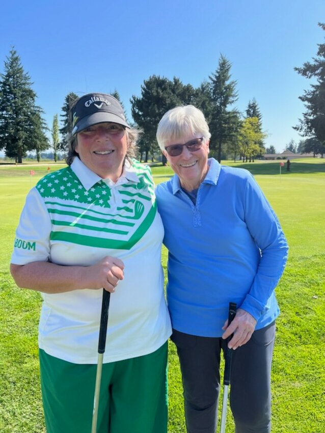 June Moran and Joann Timpone pose for a photo. The two are set to play in the quarterfinals of the Women's Net Four-Ball Match Play state championships Oct. 5 in Bremerton.