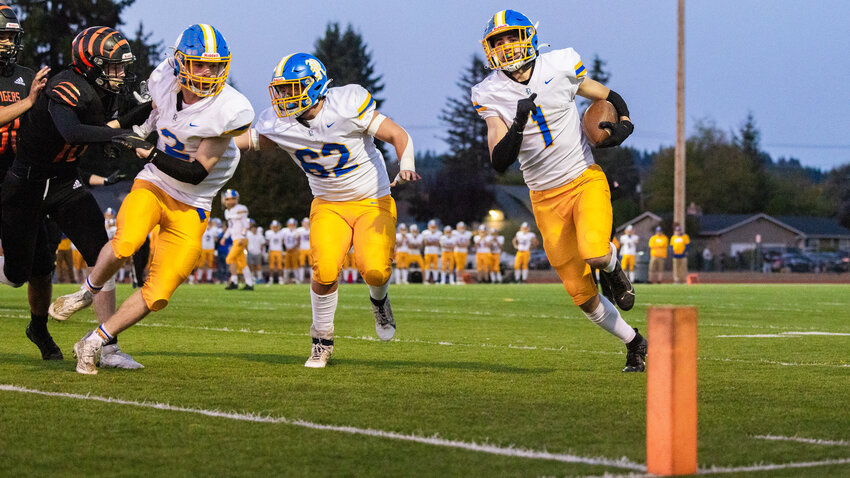 Rochester&rsquo;s Ethan Rodriguez (1) runs for the end zone behind blockers during a Friday night game against Centralia at Tiger Stadium.